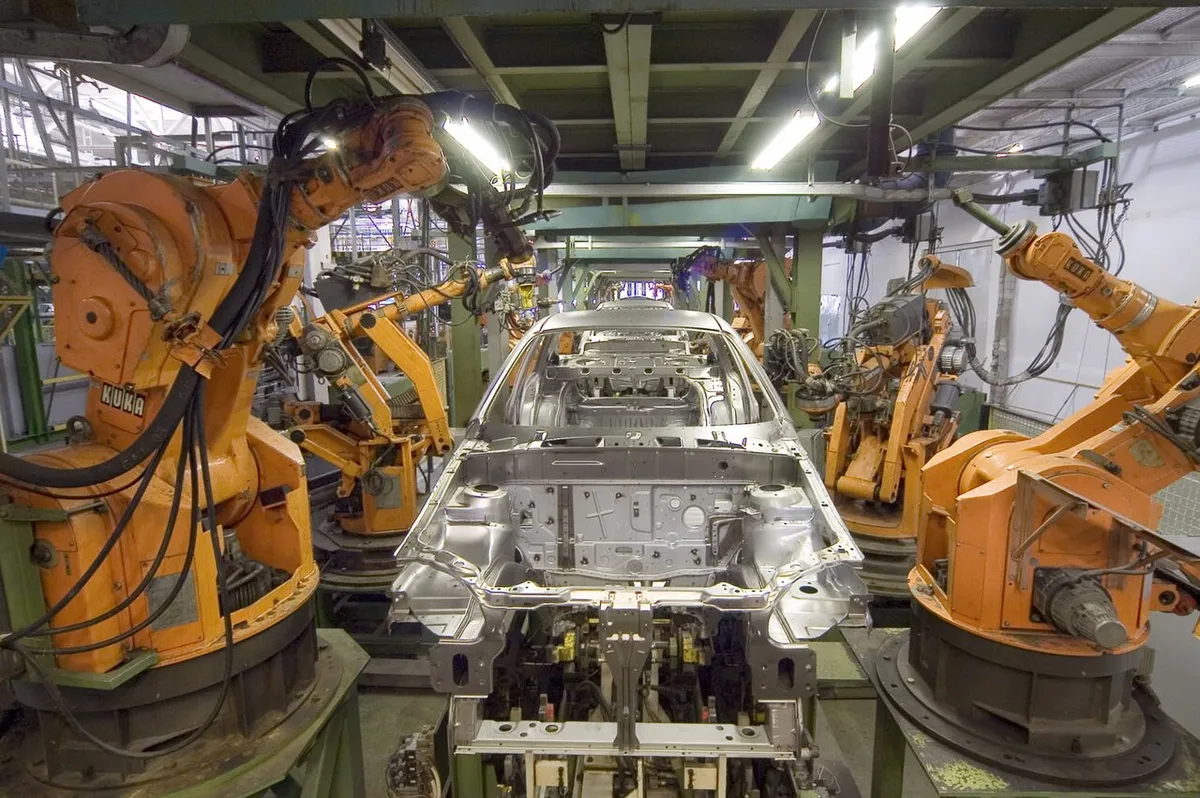 Welding robots on an automotive body-in-white